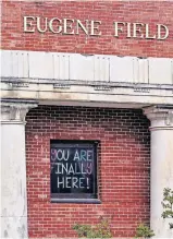  ?? LANDSBERGE­R/ THE OKLAHOMAN] ?? A sign posted on a window at Eugene Field Elementary as Oklahoma City Public Schools began the first day of the 2020-21 school year with virtual learning Monday. [CHRIS