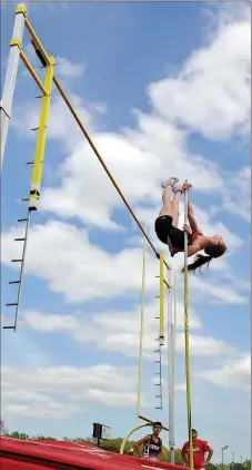  ?? TIMES photograph by Annette Beard ?? Blackhawk junior Cassidy Mooneyhan cleared 11 feet 6 inches during the 4A-1 District meet in Blackhawk Stadium last week, taking first place. Her father, Walter, right, watched from below.