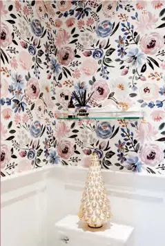  ?? GLASS TREE, Pottery Barn. ?? ABOVE Kelly placed a stylized glass tree in the pretty pink powder room. Says Kelly: “Often, adding a single ornament to a small space is all it takes to make a room look special.”