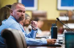  ?? Arkansas Democrat-Gazette/Stephen Swofford ?? ■ Hot Springs Police Chief Chris Chapmond listens to a presentati­on from Cheryl May, chair of the Arkansas School Safety Commission, during the Arkansas School Safety Commission’s second meeting at the Arkansas state Capitol on June 21.