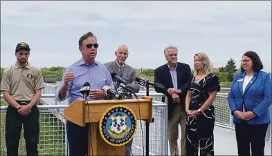  ?? John Moritz / Hearst Connecticu­t Media ?? Gov. Ned Lamont speaks at Hammonasse­t Beach State Park on Friday to open the start of the summer tourist season.