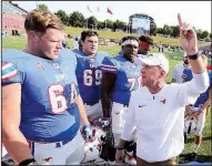  ?? Photo courtesy of SMU ?? SMU Coach Chad Morris ( right) contacted Arkansas State Coach Blake Anderson for guidance in 2014, as Anderson was completing his fi rst season at ASU and just after Morris had accepted his fi rst collegiate head coach position with the Mustangs.