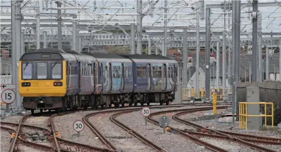  ??  ?? Northern 142032 trails the 1323 departure from Blackpool North on September 4 2018. The overhead line equipment was energised four months previously as part of the Network Rail’s £1 billion North West Electrific­ation Programme. Government is currently investing £13bn to improve connection­s across the North between 2015-20. PAUL BIGLAND/ RAIL.