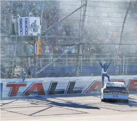  ?? THE ASSOCIATED PRESS FILE ?? Ricky Stenhouse Jr. celebrates at the finish line after winning a NASCAR Cup Series race at Talladega Superspeed­way in May. The series is back at the Alabama track this weekend.