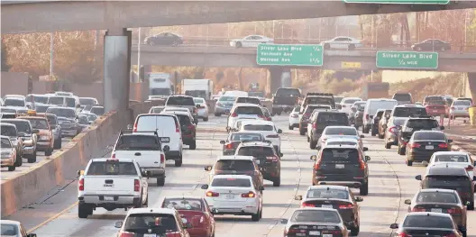  ?? DAMIAN DOVARGANES/AP 2018 ?? A nationwide speed limit of 55 mph was imposed in response to the 1973 oil embargo and abandoned in the 1990s. Above, traffic clogs a Los Angeles freeway.