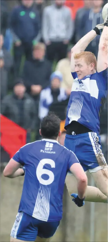  ??  ?? Blues John Kermode competes with Sean McCann for a high ball during Sunday’s Louth senior football final in Drogheda.