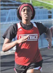  ??  ?? LFO’s Jakia Bentley sprints down the track during last week’s three-team meet at Heritage High School. The LFO boys won the meet, while the LFO girls finished second to Southeast Whitfield. (Photo by Scott Herpst)