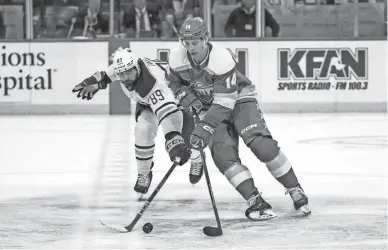  ?? MATT BLEWETT/USA TODAY SPORTS ?? Sabres right wing Alex Tuch (89) steals the puck from Wild center Joel Eriksson Ek in overtime at Xcel Energy Center.