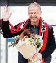  ?? ?? South Korea’s new national soccer team head coach Jurgen Klinsmann waves upon his arrival at the Incheon Internatio­nal Airport in Incheron, South Korea. (AP)