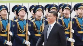  ??  ?? MOSCOW: Chinese Leader Xi Jinping passes a Russian honor guard during a welcoming ceremony upon his arrival to Vnukovo airport yesterday in Moscow. Chinese leader Xi Jinping arrived yesterday for an official two-day visit. —AFP