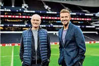  ??  ?? David Beckham and Jose Mourinho on pitch