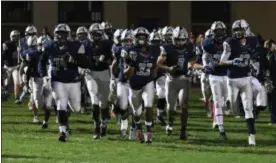  ?? MORNING JOURNAL FILE ?? The Lorain Titans take the field for the first home game of the playoffs at George Daniel Field against Lewis Center Olentangy on Nov. 4.