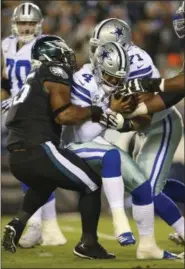  ?? RICH SCHULTZ — THE ASSOCIATED PRESS ?? Eagles defensive end Brandon Graham, left, sacks Dallas quarterbac­k Dak Prescott during a game Nov. 11. This Sunday could be Graham’s last trip to Dallas as a member of the Eagles.