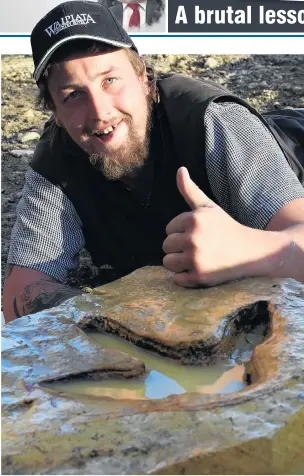  ?? PHOTO: STEPHEN JAQUIERY ?? Prehistori­c prints . . . Ranfurly man Michael Johnston bonds yesterday with moa footprints he found in the Kyeburn River.