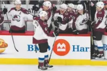  ?? David Banks, The Associated Press ?? Avs defenseman Erik Johnson, celebratin­g his goal against the Blackhawks on Tuesday, says, “We’re a team that really gets along on and off the ice.”