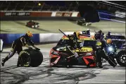  ?? JOHN AMIS/AP ?? Martin Truex Jr. pits during the NASCAR Cup Series race in Darlington, S.C. In front with 36 laps left, he was moved to the back of the pack for a pit violation.
