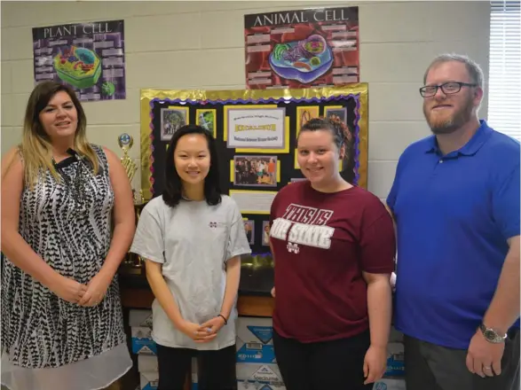  ?? (Photo by Charlie Benton, SDN) ?? From left to right: Starkville High School Biology Teacher Sarah Langford, sophomore Helen Peng, senior Angelica Sinclair and biology teacher Michael Adam. Peng and Sinclair will compete in the Internatio­nal Science Fair in Los Angeles this May.