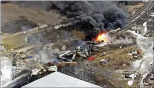  ?? GENE J. PUSKAR - THE ASSOCIATED PRESS ?? A drone photo of portions of a Norfolk Southern freight train that derailed last Friday night in East Palestine, Ohio, still on fire the next day.