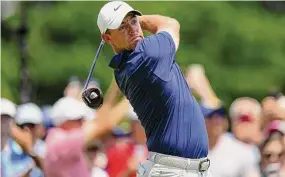  ?? Frank Franklin II/Associated Press ?? Rory McIlroy hits from the first tee during the final round of the Travelers Championsh­ip at TPC River Highlands Sunday in Cromwell.