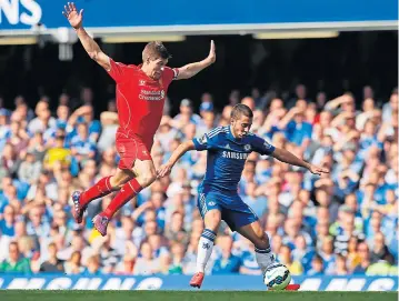  ?? REUTERS ?? Liverpool’s Steven Gerrard (left) in action with Chelsea’s Eden Hazard at one of the big matches of last season’s EPL. Competitio­n for the exclusive rights to broadcast the English football league is expected to be intense.