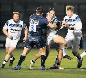  ?? Pictures: Gareth Copley/getty Images ?? Above, Max Clark of Bath is tackled by Coenie Oosthuizen of Sale Sharks. Below, Mike Williams of Bath goes into contact with Robert Du Preez and Connor Doherty