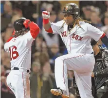  ?? STAFF PHOTO BY MATT WEST ?? FAST START: Hanley Ramirez celebrates with Andrew Benintendi after hitting a two-run homer in the first inning of last night’s win at Fenway.