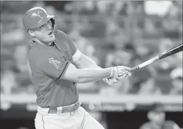  ?? Jim McIsaac Getty Images ?? MIKE TROUT connects for a third-inning double, one of three for him in the game, to help the Angels rout New York. “It’s always fun to play here and against the Yankees,” Trout said. “I see the ball good.”