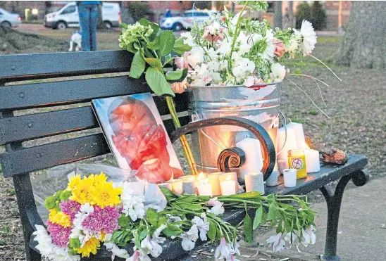  ?? ?? RACIAL ATTITUDES: A candelit vigil marking the one-year anniversar­y of the death of Ahmaud Arbery.