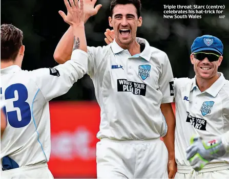  ?? AAP ?? Triple threat: Starc (centre) celebrates his hat-trick for New South Wales