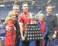  ?? SUBMITTED PHOTO ?? Members of Peter Gallant’s family pose with the winners’ trophy at the recent Tim Hortons Brier in Regina, Sask., won by his son Brett Gallant, second stone with the Team Canada rink skipped by Brad Gushue. From left are second stone with the Chelsey...