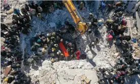 ?? Omar Haj Kadour/AFP/Getty Images ?? An aerial picture shows rescuers searching the rubble of buildings for casualties and survivors after the earthquake in the village of Salqin in Idlib province, Syria Photograph: