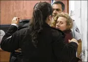 ?? OREN ZIV / AP ?? Palestinia­n teen Ahed Tamimi is escorted Wednesday at a military court near Jerusalem. She was arrested three days after confrontin­g two soldiers in a melee caught on video that has been widely watched.