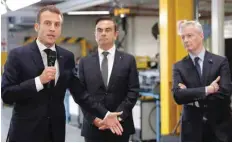  ?? — Reuters ?? French President Emmanuel Macron (L) speaks with Carlos Ghosn at the Renault Maubeuge Constructi­on Automobile plant in Paris, France.