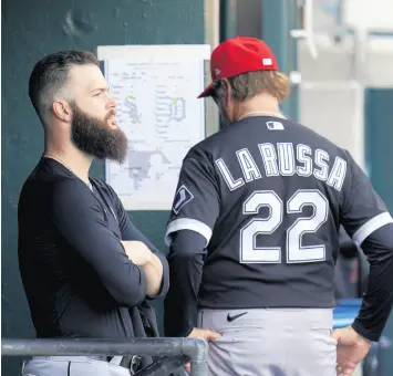  ??  ?? Dallas Keuchel watches from the dugout after being removed as manager Tony La Russa checks the lineup in the fifth inning on Saturday.