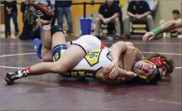  ?? AUSTIN HERTZOG - MEDIANEWS GROUP ?? Boyertown’s Gavin Sheridan scores back points on Upper Perkiomen’s Brandon Godshall in the 133-pound final Saturday.