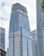  ?? AFP ?? The CapitaLand tower is seen at Singapore’s financial business district yesterday.