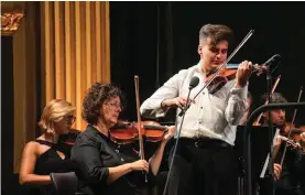  ?? ?? Violinist Kurt Falzon playing Maestro Vella’s Rapsodija Maltija