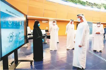  ?? WAM ?? Shaikh Mohammad Bin Zayed being briefed about Adnoc’s projects in Al Ruwais.