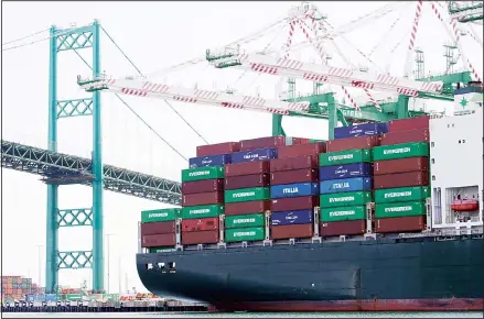  ??  ?? In this file photo, a cargo ship is docked at the Port of Los Angeles in Los Angeles. On Nov 27, the Commerce Department issues the second estimate
of how the US economy performed in the July-September quarter. (AP)