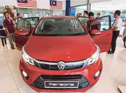  ?? FILE PIC ?? National carmaker Proton Holdings Bhd says its latest models, the Perdana, Persona, Saga and Ertiga, which were launched last year, are all equipped with three-point seatbelts.