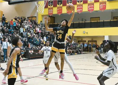  ?? JEFFREY F. BILL/STAFF ?? HIGH SCHOOL BOYS BASKETBALL
Northeast’s Torin Roberts pulls down a rebound in the first half of a Class 3A state semifinal against Long Reach.