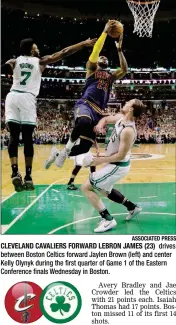  ?? ASSOCIATED PRESS ?? CLEVELAND CAVALIERS FORWARD LEBRON JAMES (23) drives between Boston Celtics forward Jaylen Brown (left) and center Kelly Olynyk during the first quarter of Game 1 of the Eastern Conference finals Wednesday in Boston.