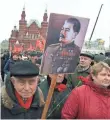  ?? VASILY MAXIMOV, AFP/GETTY IMAGES ?? Communist Party loyalists line up at the tomb of Josef Stalin in Moscow’s Red Square on March 5 for a ceremony to mark the 64th anniversar­y of his death.