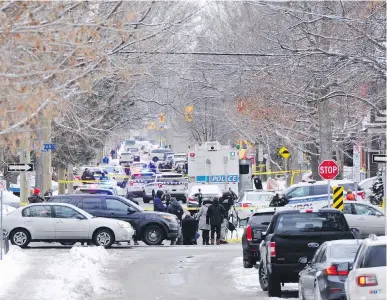  ??  ?? Police inspect the scene of a shooting in which a teenager died in downtown Ottawa on Wednesday.