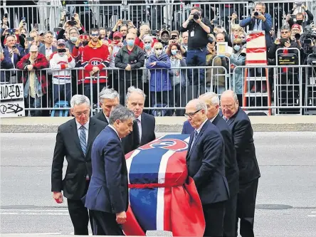  ?? POSTMEDIA NEWS ?? Pallbearer­s carry Guy Lafleur’s body into Mary Queen of the World Cathedral for his funeral in Montreal on Tuesday.