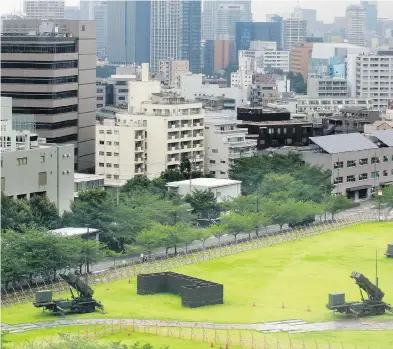  ?? SHIZUO KAMBAYASHI / THE ASSOCIATED PRESS ?? Missile units are deployed in the compound of Japan’s Ministry of Defence in Tokyo on Thursday, the day North Korea announced a detailed plan to launch a volley of ballistic missiles toward the U.S. Pacific territory of Guam.