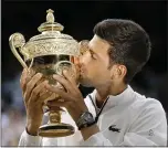  ?? TIM IRELAND — THE ASSOCIATED PRESS ?? Novak Djokovic topped Roger Federer in five sets in Sunday’s Wimbledon men’s singles final.