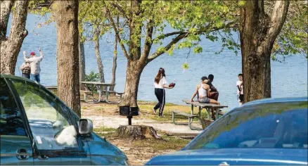  ?? JENNI GIRTMAN FOR THE AJC ?? Sweetwater Creek State Park, west of Atlanta, is open and allowing hiking, boating and fishing. While park officials stress social distancing, some groups are ignoring the mandates.