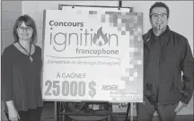  ?? SUBMITTED PHOTO ?? Co-ordinator Velma Robichaud and returning judge Olivier Bertrand of Moncton, N.B., officially launched the newly branded 2018 edition of the Francophon­e Ignition Contest Tuesday, Oct. 16, in Summerside.