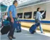  ??  ?? Passengers board the RTD University of Colorado ALine train at DIA on Friday.